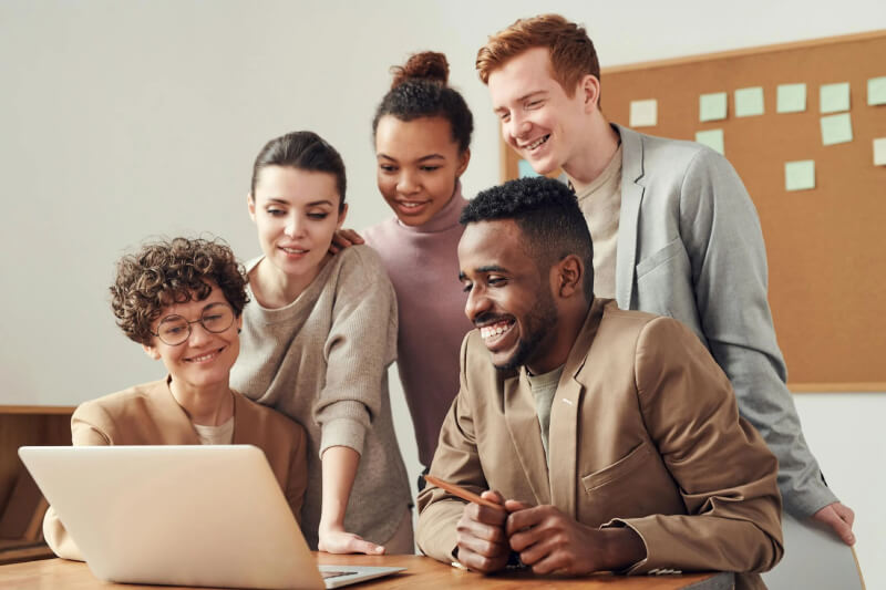 people sitting in front of laptop